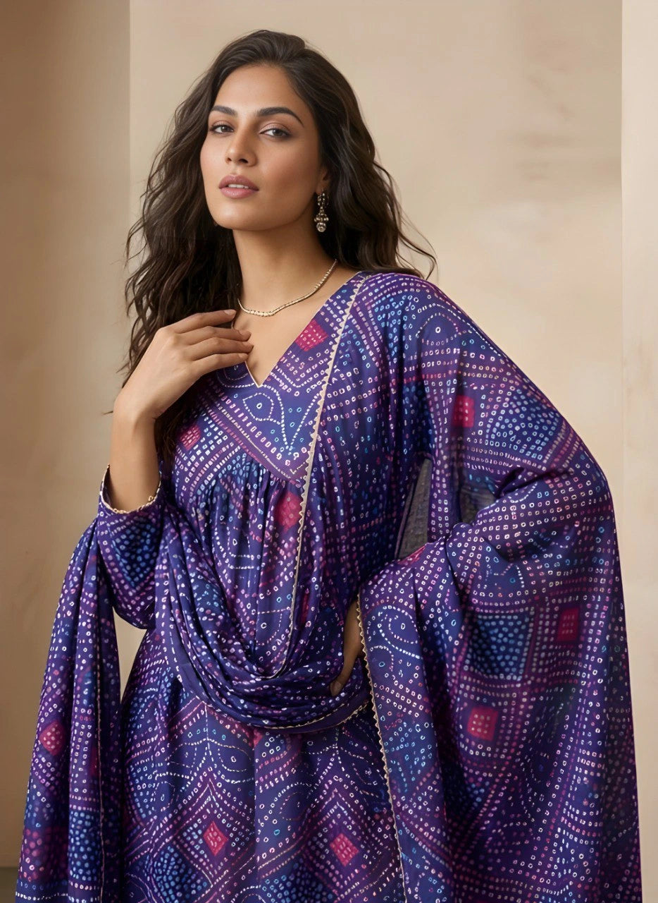 Woman wearing a purple patterned dress against a beige background